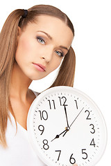 Image showing woman holding big clock