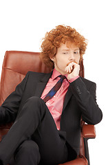 Image showing young businessman sitting in chair