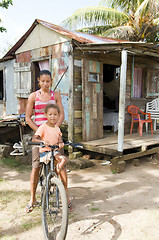 Image showing Nicaragua mother daughter bicycle poverty house Corn Island 