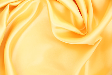 Image showing Smooth elegant golden silk as background 