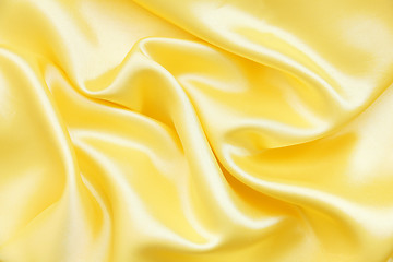 Image showing Smooth elegant golden silk as background 