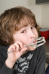 Image showing Boy Eating Dough From A Beater