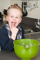 Image showing Boy Eating Dough