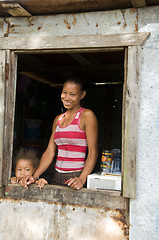 Image showing Nicaragua mother daughter  smiling poverty house Corn Island