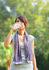 Image showing woman drink water after sport