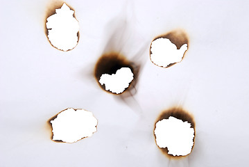 Image showing burnt holes