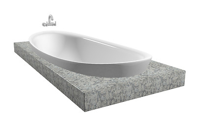 Image showing White oval bath with chrome faucet, sitting on a granite slate