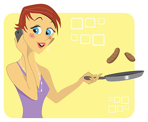 Image showing Woman talking on the phone while cooking