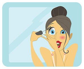 Image showing Cute brunette applying mascara or eyeliner
