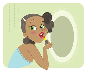 Image showing Cute dark skinned brunette woman applying lipstick