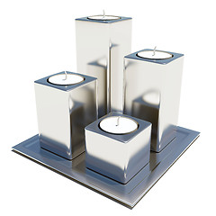 Image showing Four silver or stainless candle holders on a platter