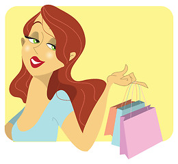 Image showing Cute redhead woman with shopping bags