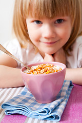 Image showing Little girl in breakfast table