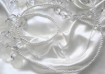 Image showing White pearls and nacreous beeds on white silk 