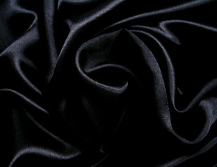 Image showing Smooth elegant black silk as background