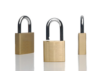 Image showing Three security gold locks