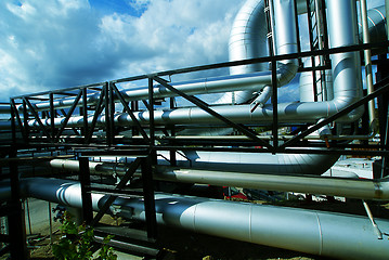 Image showing Industrial zone, Steel pipelines and valves against blue sky