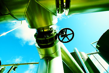 Image showing Industrial zone, Steel pipelines and valves against blue sky