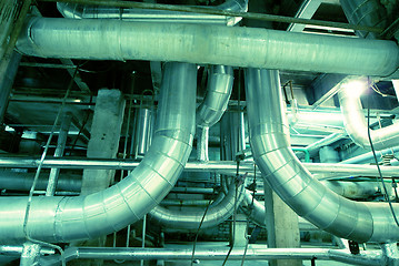 Image showing Equipment, cables and piping as found inside of a modern industr