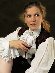 Image showing Woman with cup of red wine