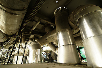 Image showing different size and shaped pipes and valves at a power plant 