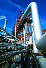 Image showing Industrial zone, Steel pipelines and valves against blue sky