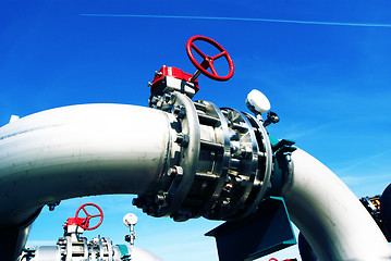 Image showing Industrial zone, Steel pipelines and valves against blue sky