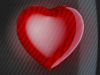 Image showing Red heart shape on carbon fiber