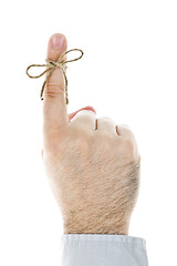 Image showing String tied on finger as reminder