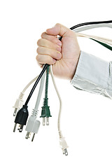 Image showing Hand holding bundle of power cables