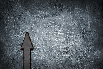 Image showing rusty arrow on grunge background