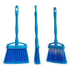 Image showing Three plasticblue brooms