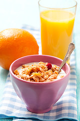 Image showing Breakfast with cereal, orange and orange juice