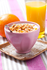 Image showing Breakfast with cereal, orange and orange juice