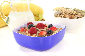 Image showing muesli with milk, fresh fruits and nuts