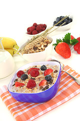 Image showing muesli with milk, fresh fruits and nuts