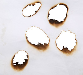 Image showing burnt holes