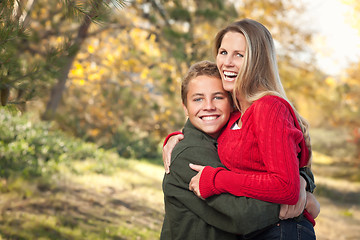 Image showing Playful Mother and Son Pose for a Portrait Outdoors