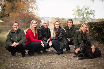 Image showing Attractive Family Pose for a Portrait Outdoors