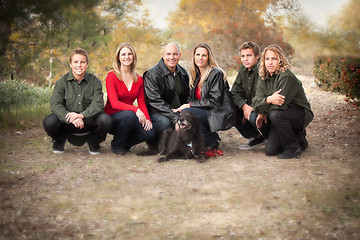 Image showing Attractive Family Pose for a Portrait Outdoors