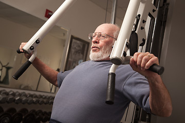 Image showing Senior Adult Man Working Out in the Gym.