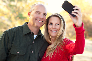 Image showing Attractive Couple Pose for a Self Portrait Outdoors