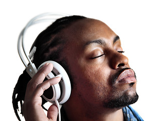 Image showing Male listening to headphones with eyes closed