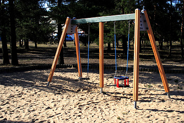 Image showing wooden swing on a children's playground