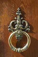 Image showing coppery wrought door knocker