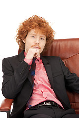 Image showing young businessman sitting in chair