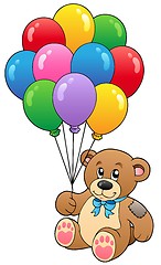 Image showing Cute teddy bear holding balloons