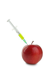 Image showing GMO: apple and syringe with unknown green liquid