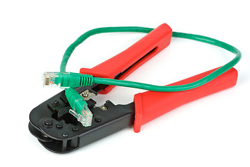 Image showing Crimping cutting tool and green patchcord