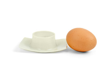 Image showing Brown boiled egg near eggcup